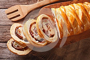 Venezuelan tasty bread pan de jamon close-up on the table. horizontal top view