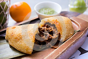 Venezuelan Venezuelan empanadas are made from precooked white or yellow cornmeal.empanadas