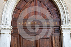 Venice, Accademia di Belle Arti wooden portal with golden letters in Italy