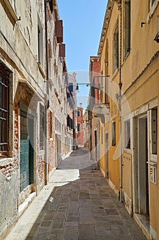 Venice alley, buildings and houses facades, nobody in Italy