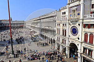 VENICE - APRIL 9, 2017: The view on San Marco Square with tourists near the Zodiac Clock Tower, on April 9, 2017 in Venice, Italy