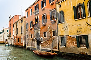 Venice canal with houses and boats.