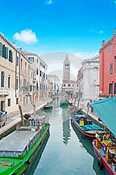 Venice canal under a blue sky