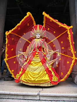 Venice Carnival: mask in red and yellow