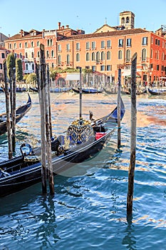 Venice cityscape, narrow water canal, campanile church on background and traditional buildings. Italy, Europe.