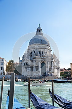 Venice cityscape view on Santa Maria della Salute basilica with gondolas on the Grand canal