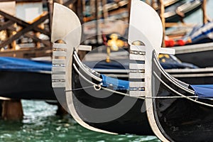 Venice Italy - Detail of two gondola prows photo