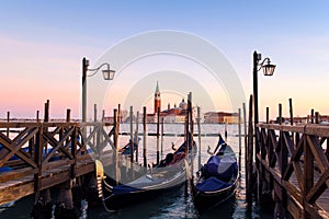 Venice with famous gondolas in lagoon at sunrise