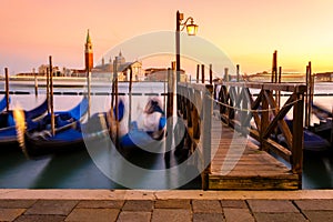 Venice with famous gondolas in lagoon at sunrise