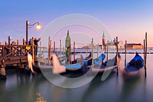 Venice with famous gondolas in lagoon at sunrise