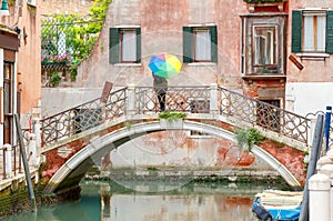 Venice. The girl with an umbrella on the bridge.