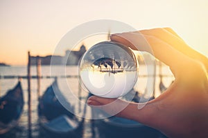 Venice gondola view through crystal glass ball