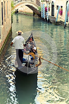 Venice gondolier driving gondola