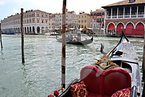 Beautiful panoramic view to the Grand canal intense gondolas marine traffic in a sunny spring day.