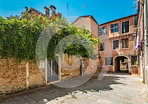 VENICE, ITALY - August 03, 2019: Narrow pedestrian streets of Venice bitween the channels. Some quiet places almost without people