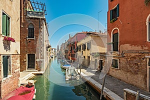 VENICE, ITALY - August 03, 2019: Narrow pedestrian streets of Venice bitween the channels. Some quiet places almost without people