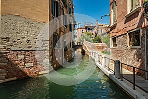 VENICE, ITALY - August 03, 2019: Narrow pedestrian streets of Venice bitween the channels. Some quiet places almost without people