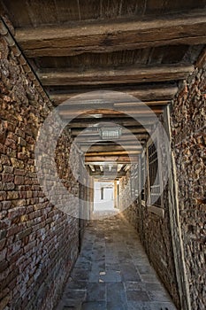 VENICE, ITALY - August 03, 2019: Narrow pedestrian streets of Venice bitween the channels. Some quiet places almost without people