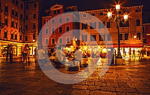 VENICE, ITALY - AUGUST 21, 2016: Famous architectural monuments, ancient streets and facades of old medieval buildings at night