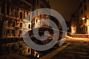 VENICE, ITALY - AUGUST 21, 2016: Famous architectural monuments, ancient streets and facades of old medieval buildings at night