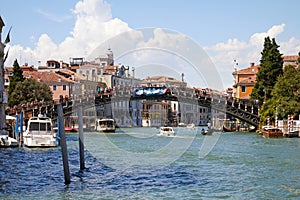 Grand Canal and Ponte Accademia bridge with people in a summer day in Venice