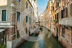 VENICE, ITALY - August 03, 2019: Narrow pedestrian streets of Venice bitween the channels. Some quiet places almost without people