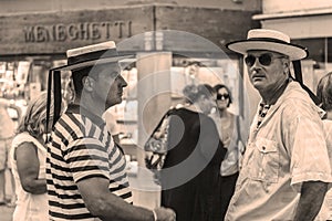 Venice.Italy. Residents of Venice. Golderriers in hats, toned- sepia