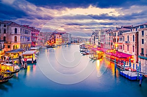 Venice, Italy. Beautiful sunset colors on Grand Canal, Rialto Bridge photo