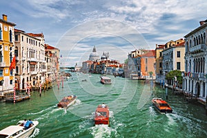 Venice, Italy. Beautiful view of Grand Canal, tourist boats and Basilica Santa Maria della Salute in background