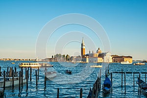 Venice, Italy - 15.08.2018: Beautiful view of the Venetian lagoon. The gondola is a traditional transport in Venice