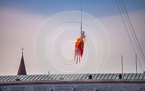 Venice, Italy - February 8, 2015: The exciting flight of the Carnival Angel officially opens Carnival festivities in St. Mark\'s