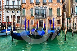 Venice, Italy. Gondolas in Grand Canal near old house. Venice Down Town