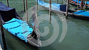 Venice, Italy - gondolas in the Grand Canal near the Rialto Bridge and between the canals of the lagoon city