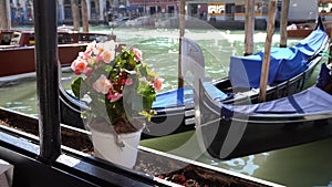 Venice, Italy - gondolas in the Grand Canal near the Rialto Bridge and between the canals of the lagoon city