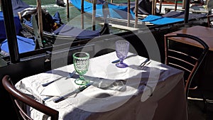 Venice, Italy - gondolas in the Grand Canal near the Rialto Bridge and between the canals of the lagoon city