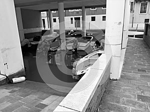 Venice, Italy, January 27, 2020 boats moored under a modern house