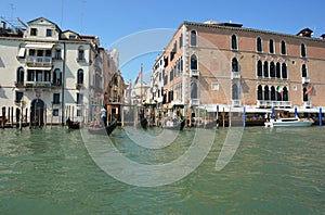 VENICE, ITALY - JULY 12, 2019 - Beautiful old houses street on the Grand Canal with  gondolas