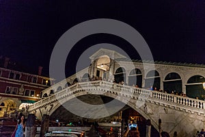 Venice, Italy - 30 June 2018: Night at Rialto bridge over the grand canal in Venice, Italy