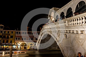 Venice, Italy - 30 June 2018: Night at Rialto bridge over the grand canal in Venice, Italy