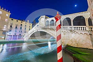 Venice, Italy with light trails on the Grand Canal passing under the Rialto Bridge