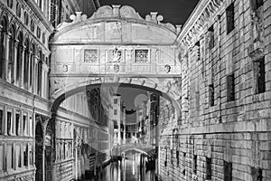 VENICE, ITALY - MAR 23, 2014: Bridge of Sighs at night with tour photo