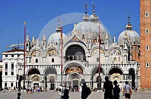 VENICE, ITALY - MAY 11, 2021: people walking near saint mark bell tower and palace of Doge in Venice, Italy