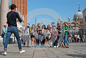 Venice, Italy - 08 May 2018: Piazza San Marco. A group of Korean students photographed on the background of the