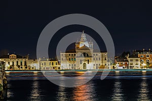 Venice Italy night view of Giudecca island with illuminated Le Zitelle Roman Catholic church, Santa Maria della Presentazione photo