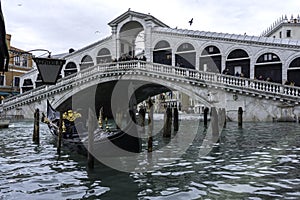 VENICE, ITALY - November 17, 2017: Rialto bridge during flood acqua alta in Venice, Italy. Venice high water. Natural disaster