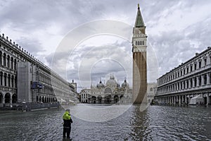 VENICE, ITALY - November 17, 2017: St. Marks Square Piazza San Marco during flood acqua alta in Venice, Italy. Venice high