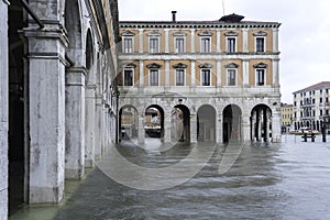 VENICE, ITALY - November 24, 2019: flood acqua alta in Venice, Italy. Venice high water. Tourists in Venice during a flood in