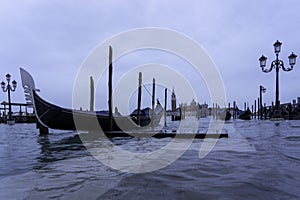 VENICE, ITALY - November 24, 2019: St. Marks Square Piazza San Marco during flood acqua alta in Venice, Italy. Venice high