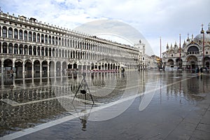 Venice, Italy - November 27, 2018: High water on St. Mark`s Square in Venice. St. Marks Square Piazza San Marco during flood