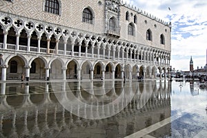 Venice, Italy - November 27, 2018: St. Marks Square Piazza San Marco during flood acqua alta in Venice, Italy. Doge`s Palace